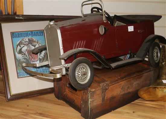 Four modern framed advertising prints, a Gordons Gin crate, a pedal car (a.f.) and a wooden panel